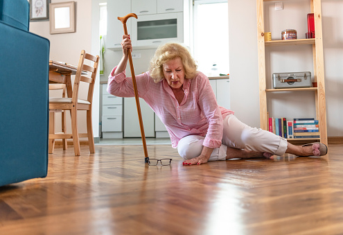 Aging adult falls on floor