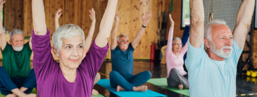 Aging adults in yoga class to practice healthy active living